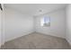 A naturally lit bedroom featuring plush carpeting and bright white walls at 3541 Arcadian Sea St, Las Vegas, NV 89106