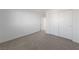 Bedroom featuring plush carpeting, closet doors, and bright white walls at 3541 Arcadian Sea St, Las Vegas, NV 89106