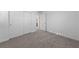 Bedroom featuring plush carpeting, closet doors, and bright white walls at 3541 Arcadian Sea St, Las Vegas, NV 89106