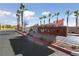 Beautiful entrance to Arcadia community with trees and stone sign at 3541 Arcadian Sea St, Las Vegas, NV 89106