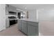 Open-concept kitchen featuring an island, stainless steel appliances, and contemporary finishes at 3541 Arcadian Sea St, Las Vegas, NV 89106