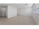 Bright living room with tile floors, neutral walls, and large windows for abundant light at 3541 Arcadian Sea St, Las Vegas, NV 89106