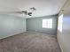 Spacious bedroom with neutral walls, carpet and a ceiling fan at 4064 Browndeer Cir, Las Vegas, NV 89129