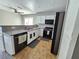 Bright kitchen featuring stainless steel appliances, white cabinets, and granite countertops at 4064 Browndeer Cir, Las Vegas, NV 89129