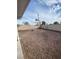 Spacious backyard with rock ground cover and privacy fencing at 4300 Don Quixote St, Las Vegas, NV 89121