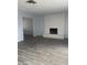 Spacious living room featuring tile floors and an eye-catching decorative fireplace at 4300 Don Quixote St, Las Vegas, NV 89121
