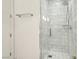 Bathroom featuring a shower with white subway tile and glass door at 4471 Dean Martin Dr # 2605, Las Vegas, NV 89103