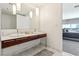 Contemporary bathroom offers a marble countertop, double sinks, and a view into the bedroom at 4471 Dean Martin Dr # 2605, Las Vegas, NV 89103