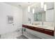 Bathroom featuring double sinks, modern lighting, and marble floors, plus a glass-enclosed shower at 4471 Dean Martin Dr # 2605, Las Vegas, NV 89103