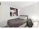 Cozy bedroom with neutral tones, a queen-size bed, and unique artwork on the white wall at 4471 Dean Martin Dr # 2605, Las Vegas, NV 89103