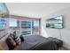 Modern bedroom features large windows with city views and a stylish upholstered bed at 4471 Dean Martin Dr # 2605, Las Vegas, NV 89103