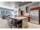Modern kitchen boasts granite countertops, stainless appliances, and island with seating at 4471 Dean Martin Dr # 2605, Las Vegas, NV 89103
