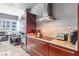 Well-equipped kitchen with stainless steel appliances, granite counters, and minimalist cherry-wood-look cabinets at 4471 Dean Martin Dr # 2605, Las Vegas, NV 89103