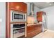 Modern kitchen featuring stainless steel appliances, granite countertops, built-in microwave, and minimalist cabinets at 4471 Dean Martin Dr # 2605, Las Vegas, NV 89103