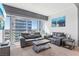 Bright living room features floor-to-ceiling windows with city views and stylish furniture at 4471 Dean Martin Dr # 2605, Las Vegas, NV 89103