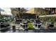 Inviting outdoor patio area with modern seating, lush landscaping, and manicured shrubbery at 4471 Dean Martin Dr # 2605, Las Vegas, NV 89103