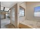 Bathroom featuring a bathtub and a large window at 4706 Obannon Dr # C, Las Vegas, NV 89102