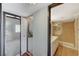 Well-lit bathroom featuring dual sinks, a spacious shower, and tiled floors, located near the bedroom at 4706 Obannon Dr # C, Las Vegas, NV 89102