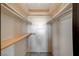 Walk-in closet with built-in shelving and carpeted floor at 4706 Obannon Dr # C, Las Vegas, NV 89102