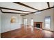 Bright living room with wood floors, fireplace, and beamed ceilings at 4706 Obannon Dr # C, Las Vegas, NV 89102