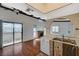 Inviting living area featuring wood floors, fireplace, and balcony access, blending comfort and outdoor living at 4706 Obannon Dr # C, Las Vegas, NV 89102