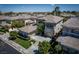 An aerial view of a two story stucco home featuring tile roof, balcony, and landscaped surroundings at 504 Pinnacle Heights Ln, Las Vegas, NV 89144