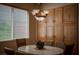 Cozy dining area with a chandelier fixture, built in storage, and a window at 504 Pinnacle Heights Ln, Las Vegas, NV 89144