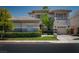 Beautiful two-story home featuring a manicured lawn and a spacious three car garage at 504 Pinnacle Heights Ln, Las Vegas, NV 89144