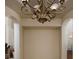An elegant foyer highlighted by its sophisticated chandelier and architectural archways leading to other rooms at 504 Pinnacle Heights Ln, Las Vegas, NV 89144