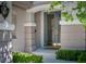 Close-up of a modern front door with decorative glass, stylish hardware, and manicured landscaping at 504 Pinnacle Heights Ln, Las Vegas, NV 89144