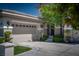Spacious three car garage with manicured front yard and mature shade tree at 504 Pinnacle Heights Ln, Las Vegas, NV 89144