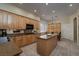 Well-equipped kitchen with custom cabinetry, central island, and modern stainless steel appliances at 504 Pinnacle Heights Ln, Las Vegas, NV 89144