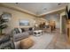 Open-concept living room with fireplace, comfortable seating, and seamless access to the kitchen at 504 Pinnacle Heights Ln, Las Vegas, NV 89144