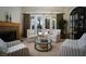 Cozy living room with fireplace, comfortable seating, and French doors leading to outdoor space at 504 Pinnacle Heights Ln, Las Vegas, NV 89144