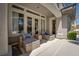 Inviting covered patio with cozy seating, perfect for relaxing outdoors with a view of the pool at 504 Pinnacle Heights Ln, Las Vegas, NV 89144