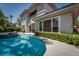 Stunning pool area complemented by manicured landscaping and a sophisticated home exterior at 504 Pinnacle Heights Ln, Las Vegas, NV 89144