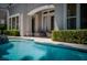 Inviting pool with lounge area and lush landscaping for a relaxing backyard oasis at 504 Pinnacle Heights Ln, Las Vegas, NV 89144