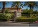 Stone Eagle Rock signage surrounded by manicured greenery and palm trees, creating a welcoming entrance at 504 Pinnacle Heights Ln, Las Vegas, NV 89144