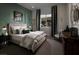 Cozy bedroom featuring a plush bed, stylish décor, and a Carpe Diem wall art, creating a welcoming atmosphere at 5725 N Conquistador St, Las Vegas, NV 89149