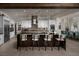 Bright, spacious kitchen featuring modern white cabinets, stainless steel appliances, a large island, and pendant lighting at 5725 N Conquistador St, Las Vegas, NV 89149