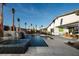 Stunning backyard pool with water feature, patio area, and desert landscaping offering an ideal space for relaxation and entertainment at 5725 N Conquistador St, Las Vegas, NV 89149