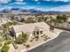 Overhead view of a single story home featuring mountain views, desert landscaping, and a three-car garage at 6206 Rio Camuy Ave, Las Vegas, NV 89131