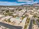 Expansive aerial view showcasing a well-maintained home with a private pool amidst a neighborhood and mountain backdrop at 6206 Rio Camuy Ave, Las Vegas, NV 89131