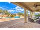 Spacious backyard with a pool, well-kept landscaping, and an outdoor seating area, perfect for entertaining at 6206 Rio Camuy Ave, Las Vegas, NV 89131
