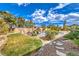 Lush backyard with a sparkling pool, grassy area, and mature landscaping, offering a private oasis at 6206 Rio Camuy Ave, Las Vegas, NV 89131