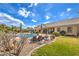 Spacious backyard with a refreshing pool, patio seating, and well-maintained landscaping for outdoor enjoyment at 6206 Rio Camuy Ave, Las Vegas, NV 89131