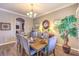 This formal dining area offers a rustic table, seating for eight, and elegant décor at 6206 Rio Camuy Ave, Las Vegas, NV 89131