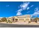 Inviting single-story home with a three-car garage, stone detailing, and a neatly landscaped front yard at 6206 Rio Camuy Ave, Las Vegas, NV 89131