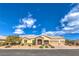 Beautiful single-story home featuring a three-car garage and a stone entryway with a well-manicured front yard at 6206 Rio Camuy Ave, Las Vegas, NV 89131