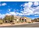 Single-story home featuring a three-car garage, stone accents, and mature landscaping in a well-maintained yard at 6206 Rio Camuy Ave, Las Vegas, NV 89131